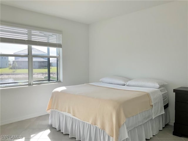 2011 Vermont Ln, Naples, FL 34120 - bedroom featuring light tile patterned floors and baseboards