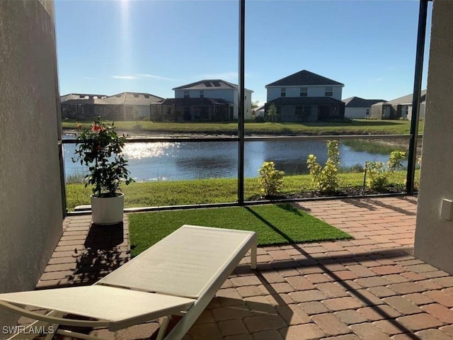 2011 Vermont Ln, Naples, FL 34120 - sunroom / solarium featuring a water view and a residential view