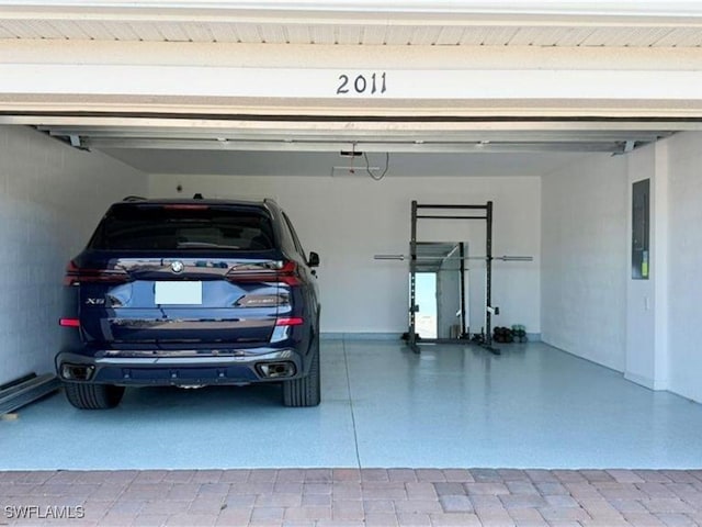 2011 Vermont Ln, Naples, FL 34120 - garage with baseboards and electric panel