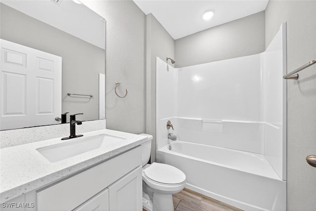 2008 NW 24th Pl, Cape Coral, FL 33993 - full bathroom with vanity, washtub / shower combination, and wood finished floors