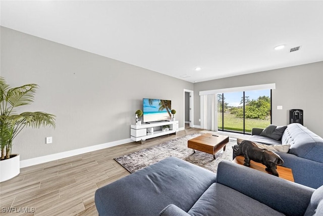 2008 NW 24th Pl, Cape Coral, FL 33993 - living room featuring wood finished floors and recessed lighting