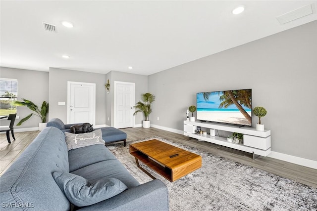 2008 NW 24th Pl, Cape Coral, FL 33993 - living room featuring wood finished floors and recessed lighting