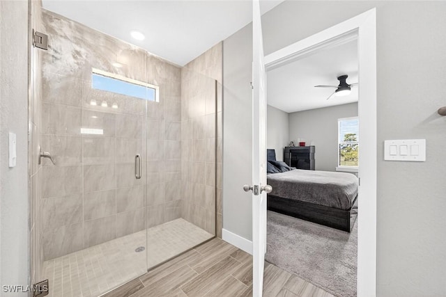 2008 NW 24th Pl, Cape Coral, FL 33993 - ensuite bathroom with a shower stall, wood finished floors, and a ceiling fan