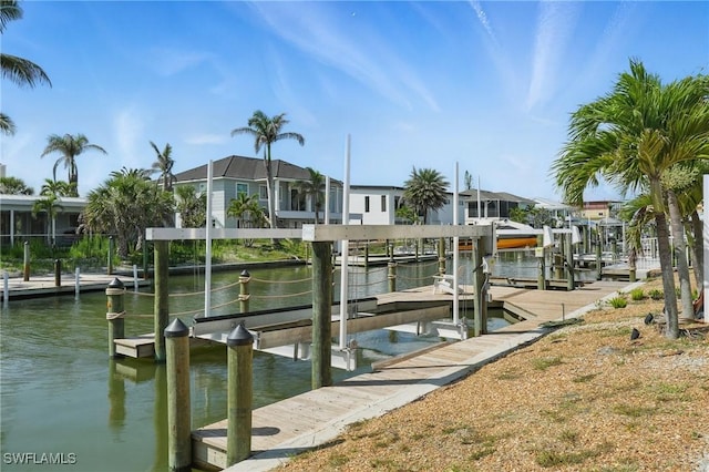 370 Bayland Rd, Fort Myers Beach, FL 33931 - dock area with boat lift, a water view, and a residential view