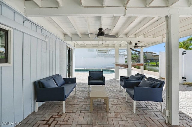 370 Bayland Rd, Fort Myers Beach, FL 33931 - view of patio / terrace featuring a ceiling fan, an outdoor living space, an outdoor pool, and a water view