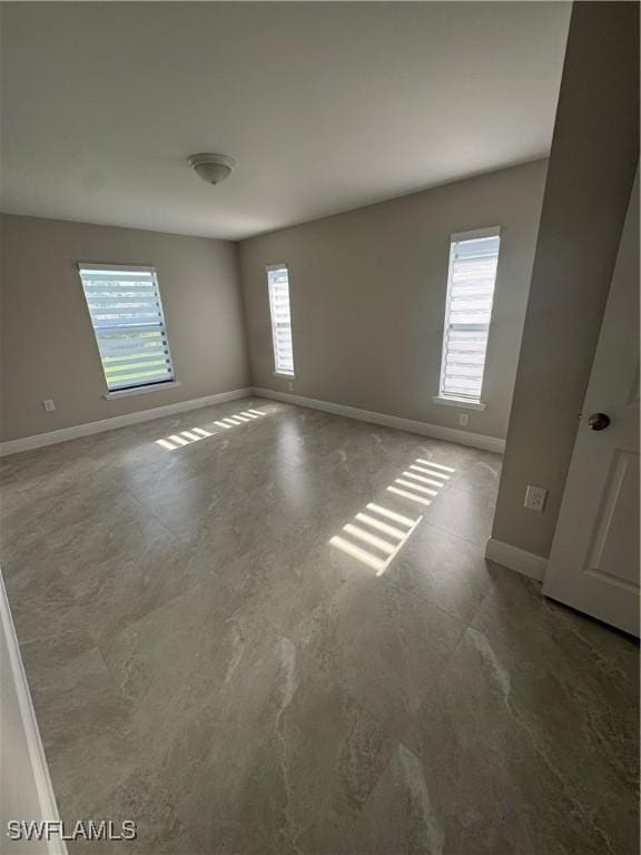 4114 2nd St SW, Lehigh Acres, FL 33976 - empty room featuring baseboards