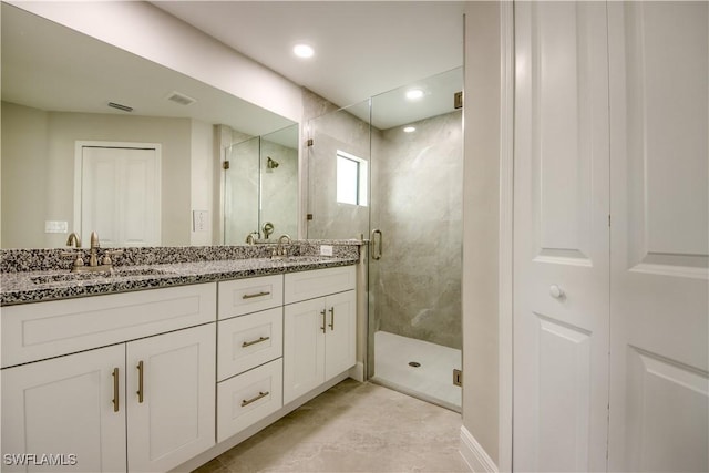 4114 2nd St SW, Lehigh Acres, FL 33976 - bathroom featuring a stall shower, double vanity, and recessed lighting