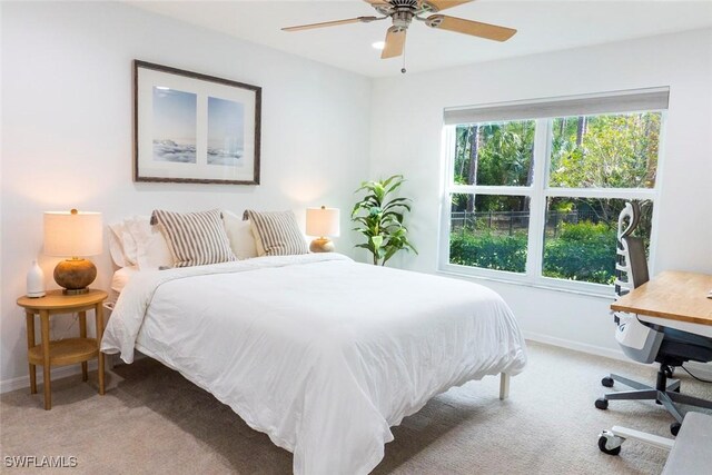 3430 27th Ave SW, Naples, FL 34117 - bedroom featuring light carpet, baseboards, and ceiling fan