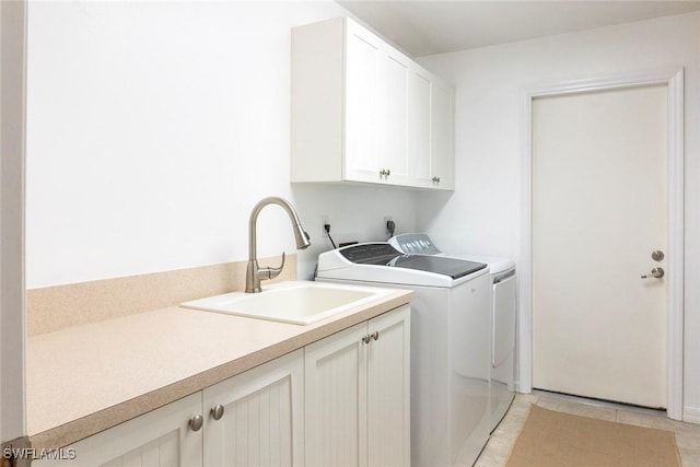 3430 27th Ave SW, Naples, FL 34117 - washroom with cabinet space, separate washer and dryer, and light tile patterned floors