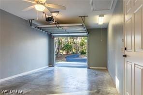 3430 27th Ave SW, Naples, FL 34117 - garage featuring baseboards and a garage door opener