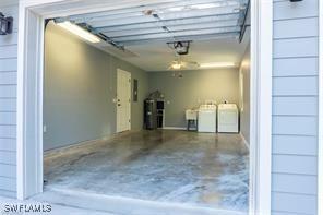 3430 27th Ave SW, Naples, FL 34117 - garage featuring a garage door opener