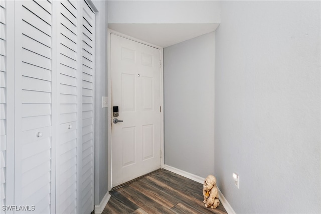950 Moody Rd Unit 124, North Fort Myers, FL 33903 - doorway with dark wood-style floors and baseboards