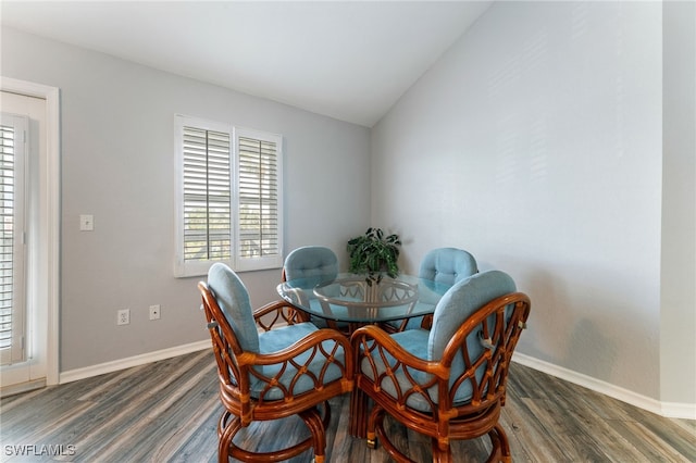 950 Moody Rd Unit 124, North Fort Myers, FL 33903 - dining space with vaulted ceiling and wood finished floors