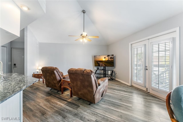 950 Moody Rd Unit 124, North Fort Myers, FL 33903 - living room featuring dark wood-style floors, ceiling fan, vaulted ceiling, baseboards, and french doors