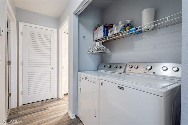 950 Moody Rd Unit 124, North Fort Myers, FL 33903 - washroom featuring light wood finished floors and washing machine and clothes dryer