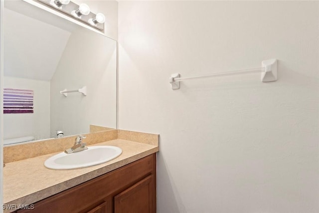 3940 Cherrybrook Loop, Fort Myers, FL 33966 - bathroom with vanity and lofted ceiling