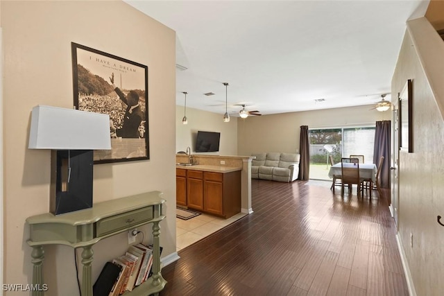 3940 Cherrybrook Loop, Fort Myers, FL 33966 - corridor with light wood-style floors and a sink