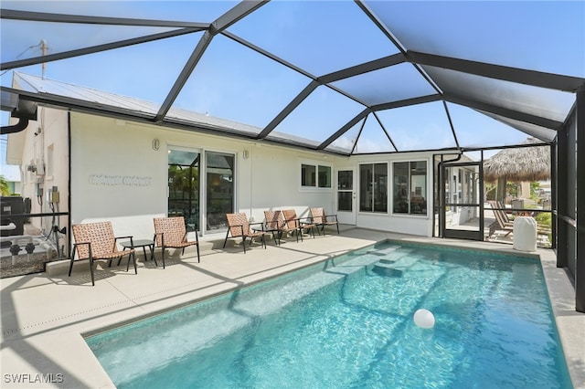 2749 Bruce St, Matlacha, FL 33993 - rear view of house featuring a patio, an outdoor pool, stucco siding, and a lanai