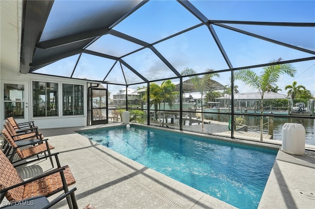 2749 Bruce St, Matlacha, FL 33993 - outdoor pool featuring a patio area and glass enclosure