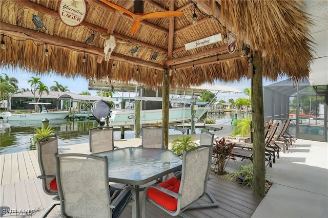 2749 Bruce St, Matlacha, FL 33993 - dock area featuring boat lift, a gazebo, a water view, and outdoor dining area
