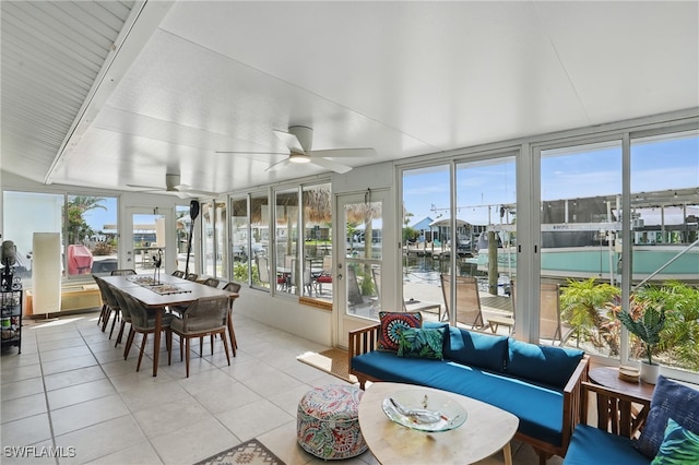 2749 Bruce St, Matlacha, FL 33993 - sunroom featuring tile patterned floors and a water view