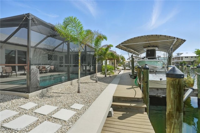 2749 Bruce St, Matlacha, FL 33993 - dock featuring boat lift, an outdoor pool, a lanai, and a patio area