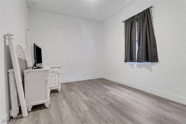 3320 41st Ave NE, Naples, FL 34120 - unfurnished room with light wood-type flooring and baseboards