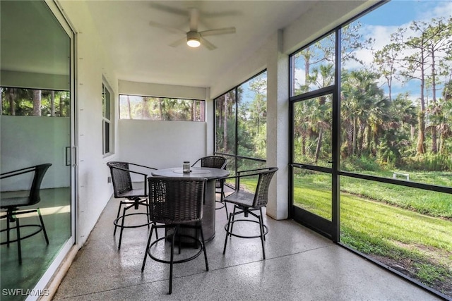 3320 41st Ave NE, Naples, FL 34120 - sunroom / solarium featuring a ceiling fan, outdoor dining area, and healthy amount of natural light