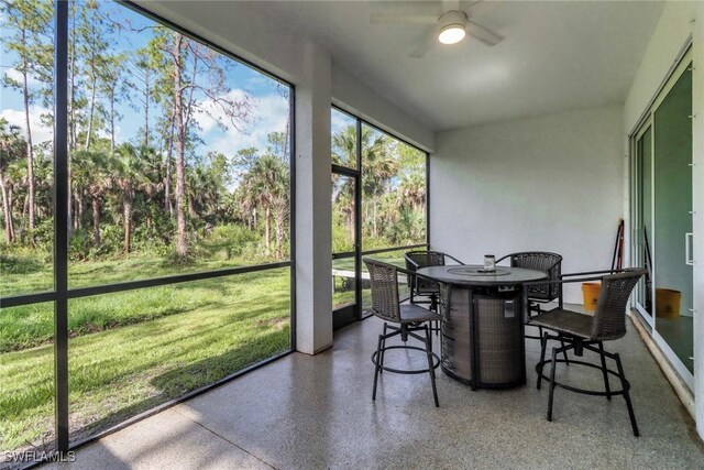 3320 41st Ave NE, Naples, FL 34120 - sunroom with a ceiling fan