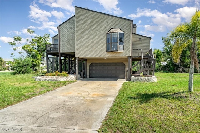 7786 Breakwater Ct, Bokeelia, FL 33922 - view of front of house with stairs, an attached garage, a front lawn, and driveway