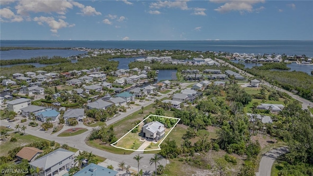 7786 Breakwater Ct, Bokeelia, FL 33922 - aerial perspective of suburban area featuring a large body of water and property parcel outlined
