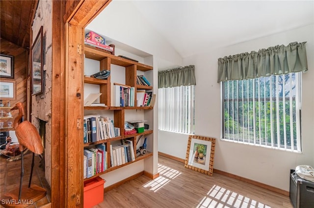 7786 Breakwater Ct, Bokeelia, FL 33922 - sitting room with wood finished floors and lofted ceiling