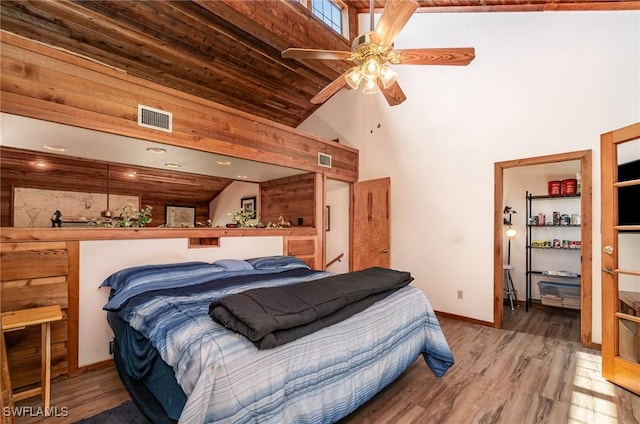 7786 Breakwater Ct, Bokeelia, FL 33922 - bedroom with wood finished floors and a high ceiling