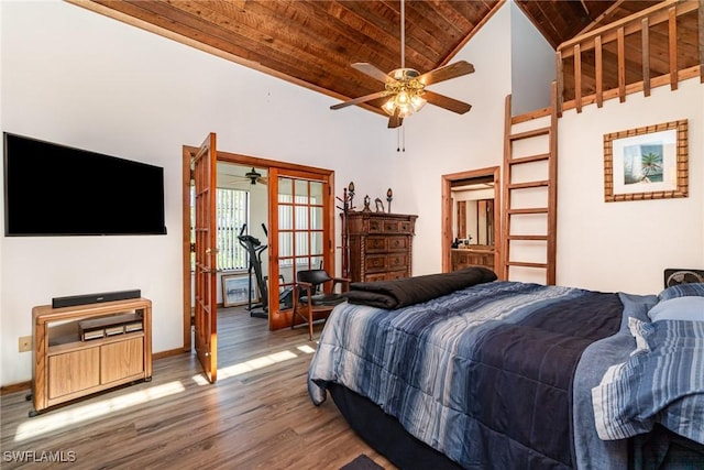 7786 Breakwater Ct, Bokeelia, FL 33922 - bedroom featuring wood ceiling, wood finished floors, french doors, and high vaulted ceiling