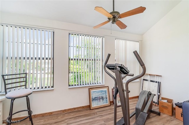 7786 Breakwater Ct, Bokeelia, FL 33922 - exercise room with wood finished floors, ceiling fan, and lofted ceiling