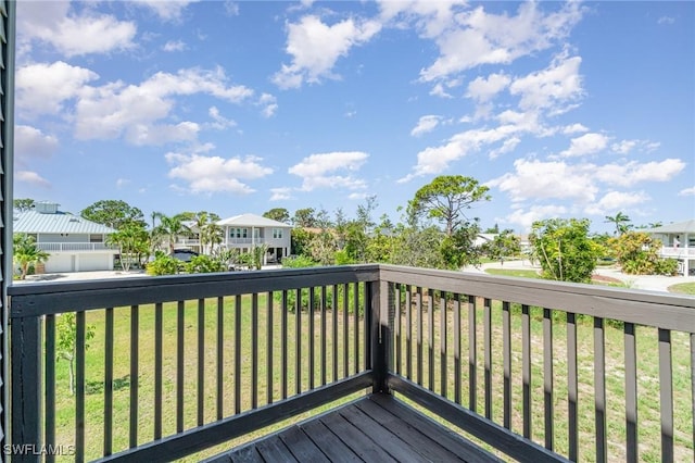 7786 Breakwater Ct, Bokeelia, FL 33922 - deck featuring a residential view and a lawn