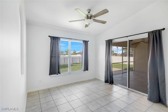 726 SW 12th St, Cape Coral, FL 33991 - unfurnished room featuring a ceiling fan, healthy amount of natural light, vaulted ceiling, and light tile patterned floors