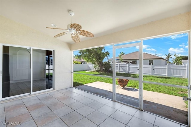 726 SW 12th St, Cape Coral, FL 33991 - unfurnished sunroom featuring a ceiling fan and vaulted ceiling