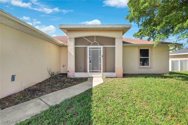 726 SW 12th St, Cape Coral, FL 33991 - entrance to property featuring a yard and stucco siding