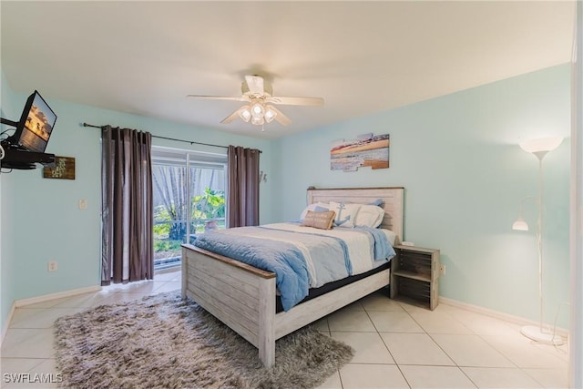 1525 SW 43rd Ter, Cape Coral, FL 33914 - bedroom featuring light tile patterned flooring, access to outside, baseboards, and a ceiling fan
