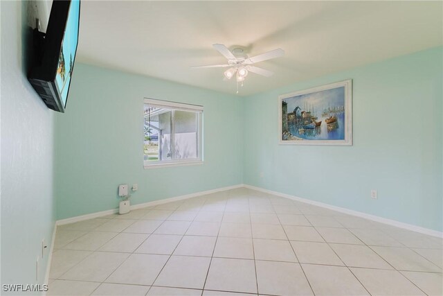 1525 SW 43rd Ter, Cape Coral, FL 33914 - tiled spare room with ceiling fan and baseboards