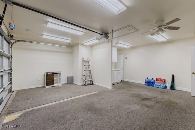 1525 SW 43rd Ter, Cape Coral, FL 33914 - garage with a garage door opener, ceiling fan, and baseboards