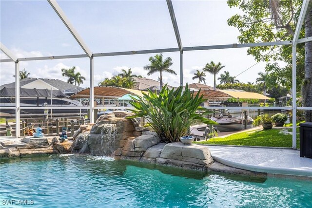 1525 SW 43rd Ter, Cape Coral, FL 33914 - outdoor pool featuring a lanai, a dock, and boat lift