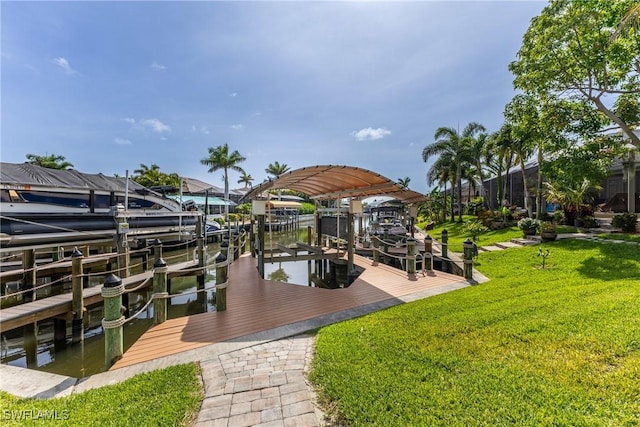 1525 SW 43rd Ter, Cape Coral, FL 33914 - dock with boat lift and a lawn