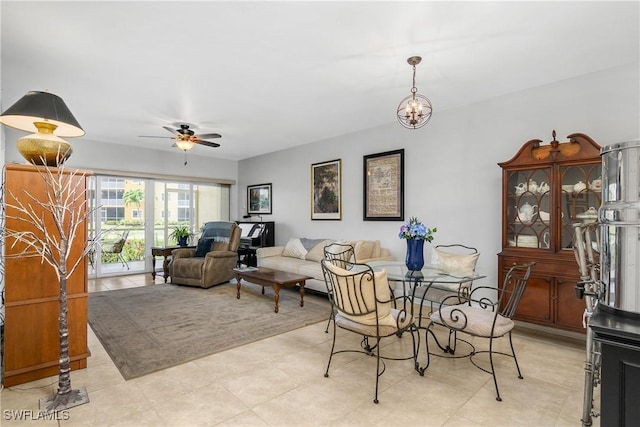 10020 Maddox Ln Unit 113, Bonita Springs, FL 34135 - dining area featuring ceiling fan, a chandelier, and light tile patterned floors