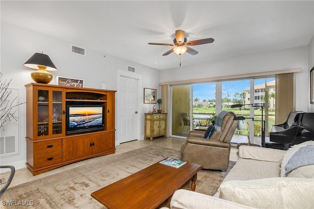 10020 Maddox Ln Unit 113, Bonita Springs, FL 34135 - tiled living room with ceiling fan and baseboards
