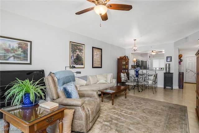 10020 Maddox Ln Unit 113, Bonita Springs, FL 34135 - living room featuring ceiling fan and tile patterned floors