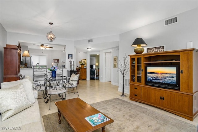 10020 Maddox Ln Unit 113, Bonita Springs, FL 34135 - living room with ceiling fan and a chandelier