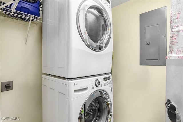10020 Maddox Ln Unit 113, Bonita Springs, FL 34135 - laundry room featuring stacked washing machine and dryer and electric panel