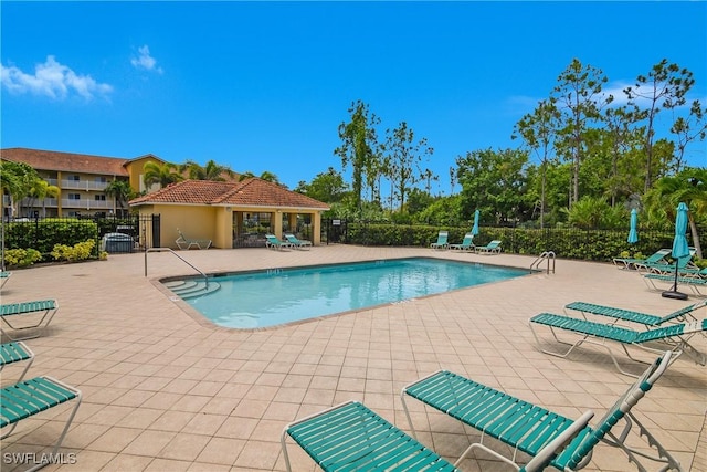 10020 Maddox Ln Unit 113, Bonita Springs, FL 34135 - community pool with a patio